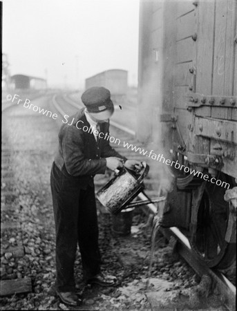 OILMAN AT WORK ON BRAKES